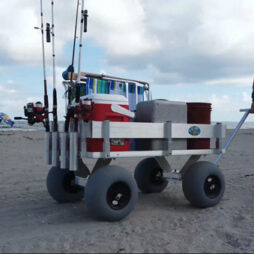aluminum wagon with balloon tires and fishing gear on the beach