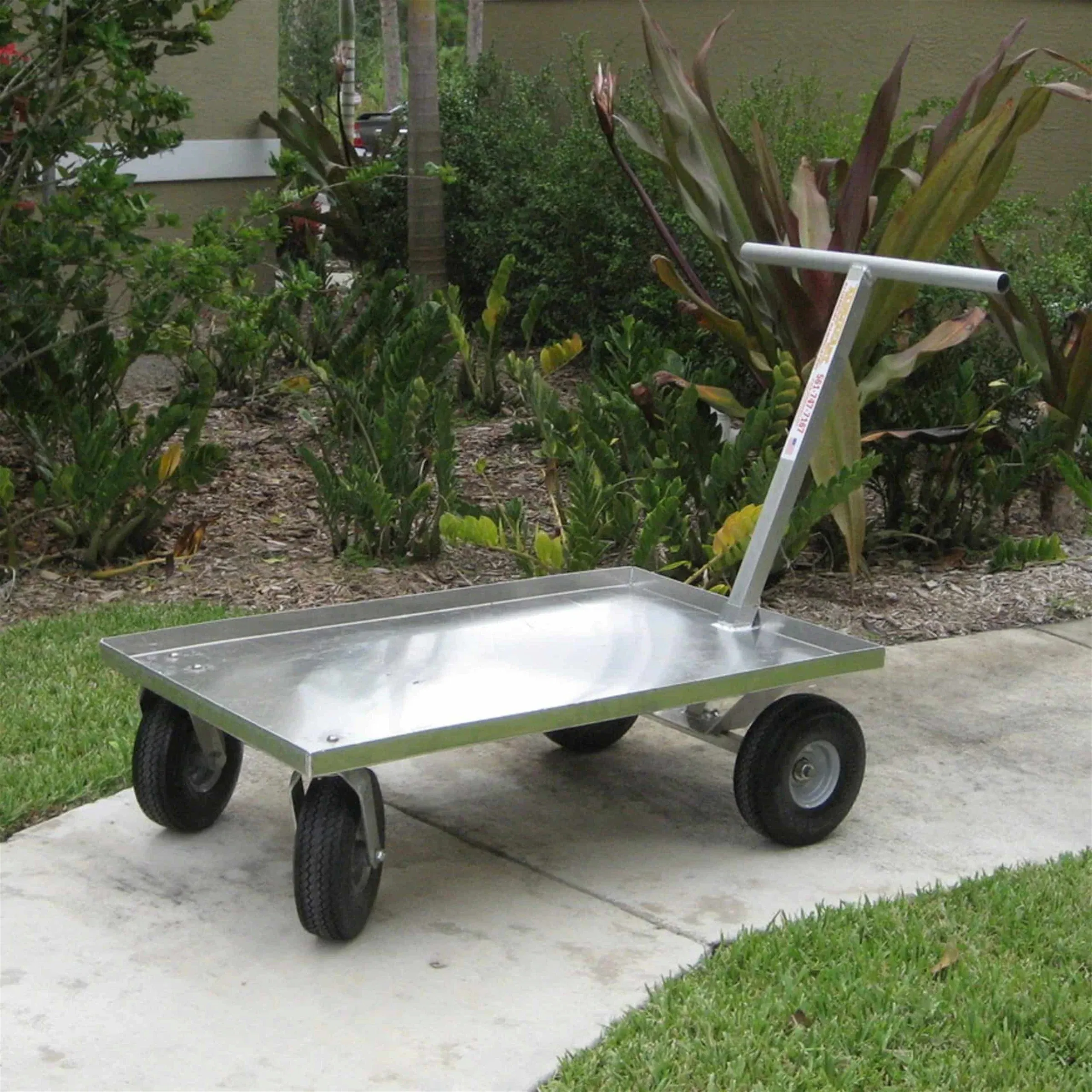 Kahuna Wagon all aluminum PUSH WAGON parked on a sidewalk area.